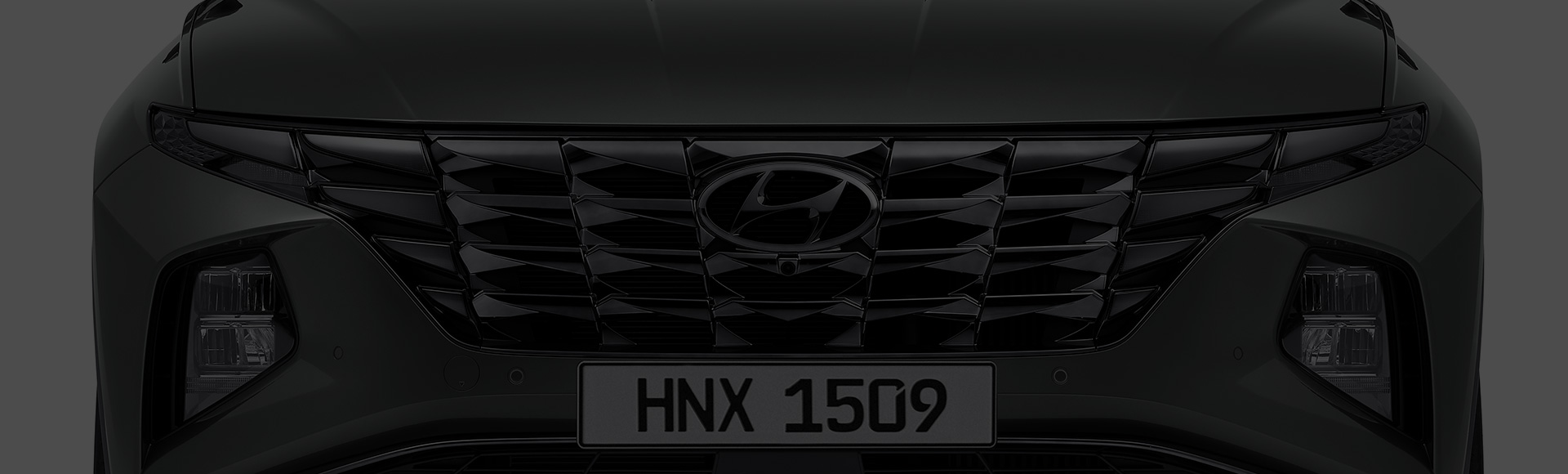 Closer view at the front part of Hyundai car with its logo and grille